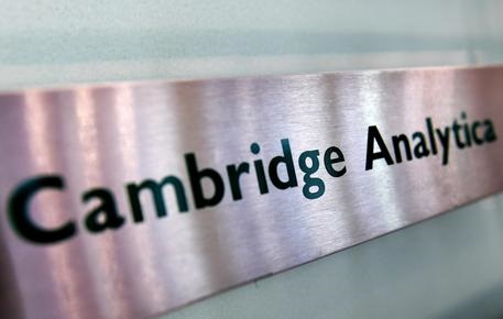 Britain's Information Commissioner awaits warrant to search the offices of Cambridge Analytica.