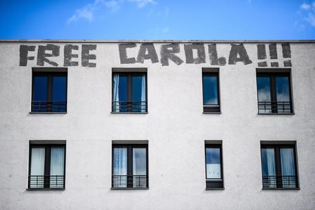 Graffiti in Berlin protests arrest of German captain Carola Rackete in Italy